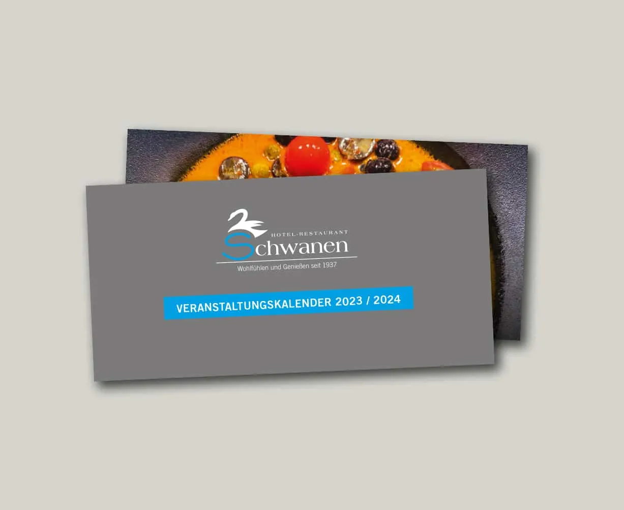 Graues Veranstaltungsprogramm des Hotel-Restaurant Schwanen 2023/2024 vor Bild mit buntem Dessert.